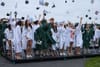 Mortarboards fly as showers subside